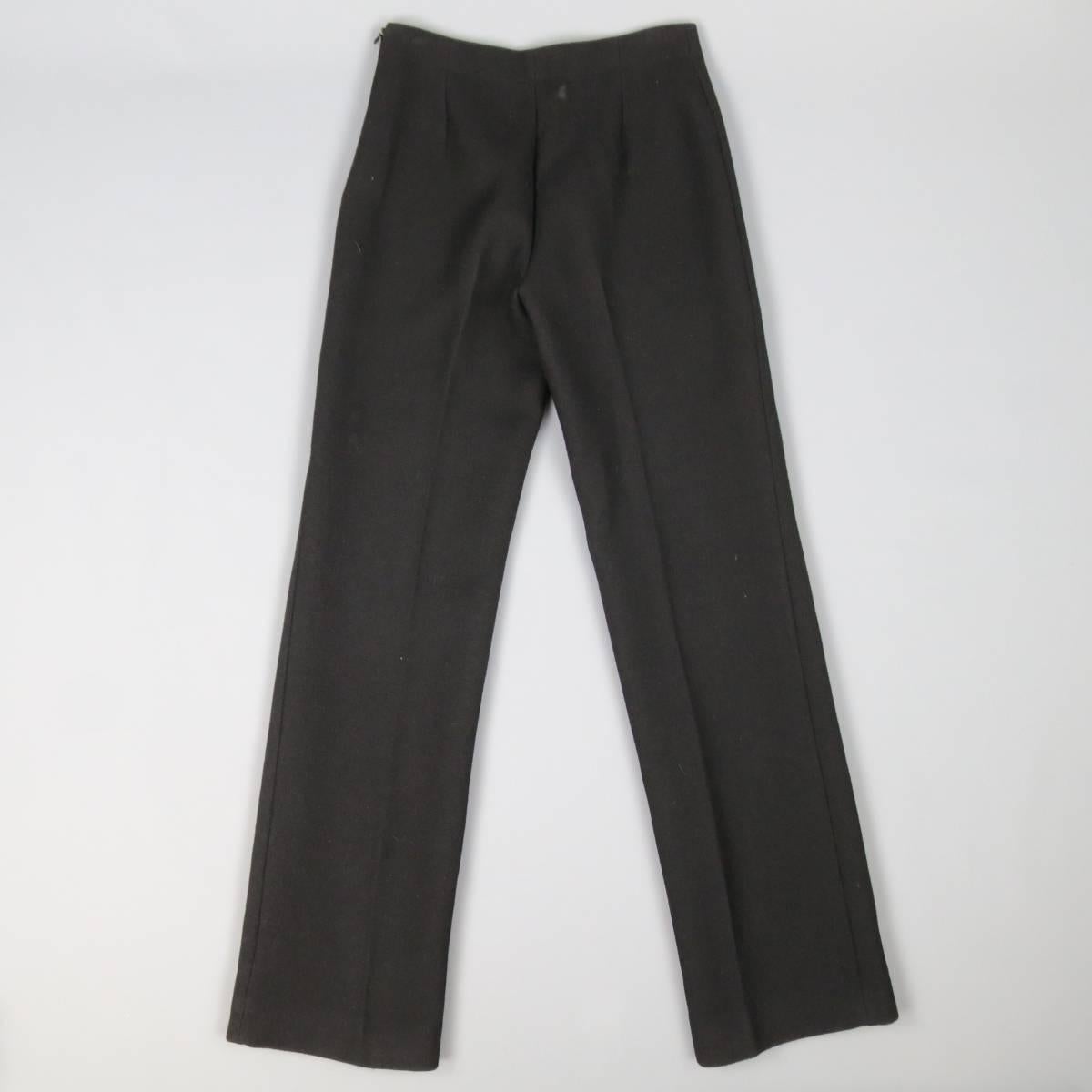 ALAIA dress pants in a heavy wool canvas fabric featuring a streamline, minimalist construction, flat front, straight leg, and side zip closure. Made in Italy.
 
Excellent Pre-Owned Condition.
Marked: 38
 
Measurements:
 
Waist: 28 In.
Rise: 10