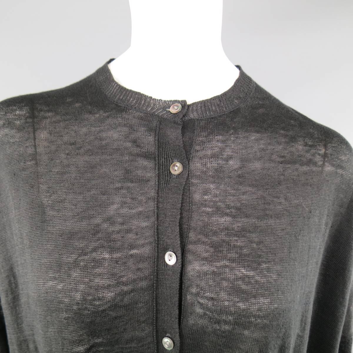 ARTS&SCIENCE drop shoulder cardigan in a light weight, sheer linen knit featuring a wide, oversized fit, button up front, and crew neckline. Made in Japan.
 
Excellent Pre-Owned Condition.
Marked: JP 1
 
Measurements:
 
Shoulder: 31 in.
Bust: 62
