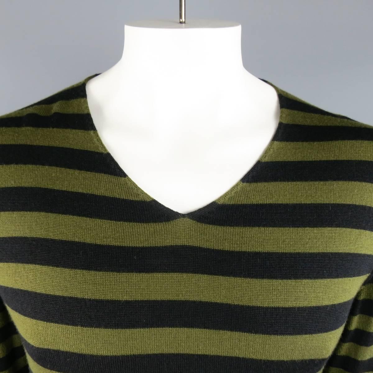 BLACK by COMME DES GARCONS pullover comes in an olive and black thick striped wool material and a V neck. Made in Japan.
 
Excellent Pre-Owned Condition
Marked Size: XL AD2014
 
Measurements
 
Shoulders: 18 in.
Sleeve: 26 in.
Chest: 40 in.
Length: