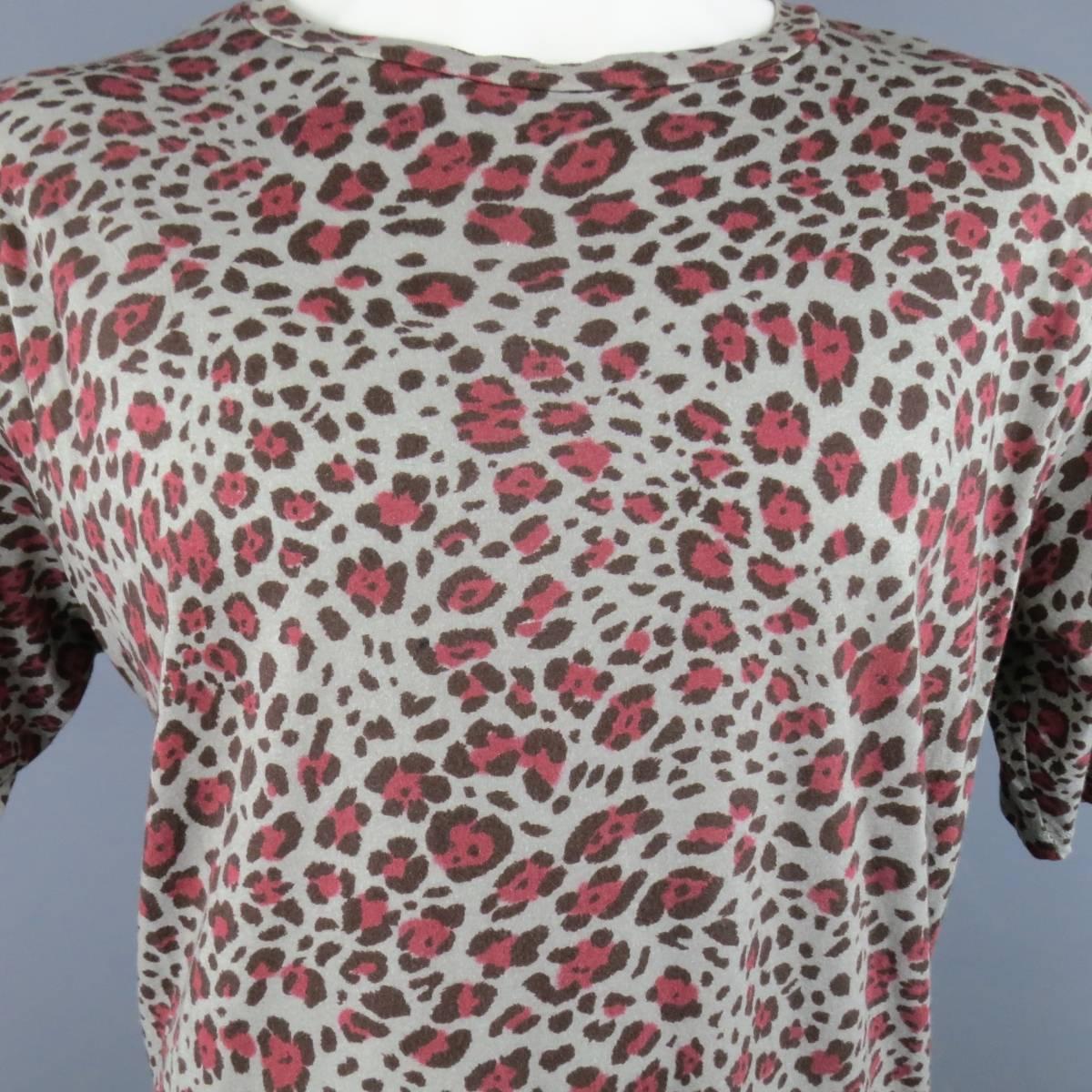 DRIES VAN NOTEN short sleeve T-shirt in a light gray soft cotton jersey with all over red cheetah leopard print featuring an oversized fit and scoop neck.
 
Excellent Pre-Owned Condition.
Marked: Large
 
Measurements:
 
Shoulder: 22 in.
Chest: 52