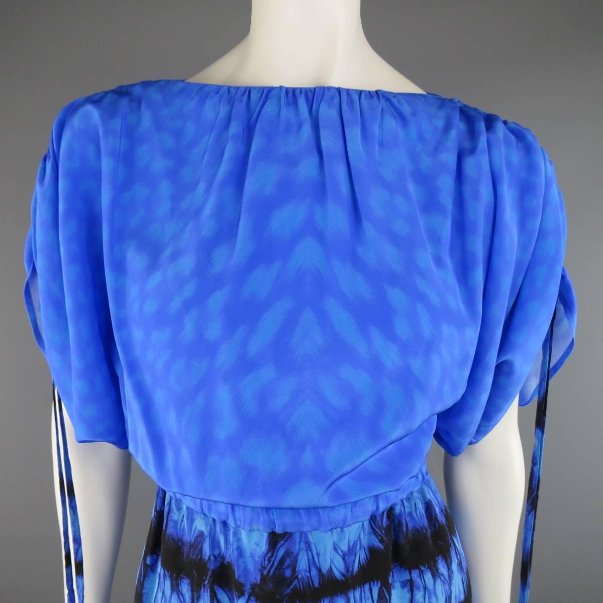 ROBERTO CAVALLI mini dress in a light weight silk crepe featuring a blue cheetah blousy fit top with gathered boat neck and drawstring bat wing sleeves, elastic waistband, and black tie die print mini skirt. Made in Italy.
 
Excellent Pre-Owned