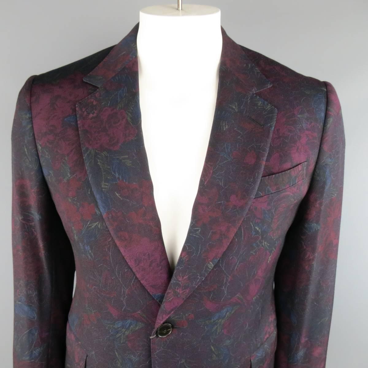 New GUCCI sport coat in a retro burgundy floral print wool twill featuring a wide notch lapel, two button closure, and double vented back. Made in Italy.
 
New with Tags. Retails at $3390.00.
Marked: IT 52
 
Measurements:
 
Shoulder: 18 in.
Chest:
