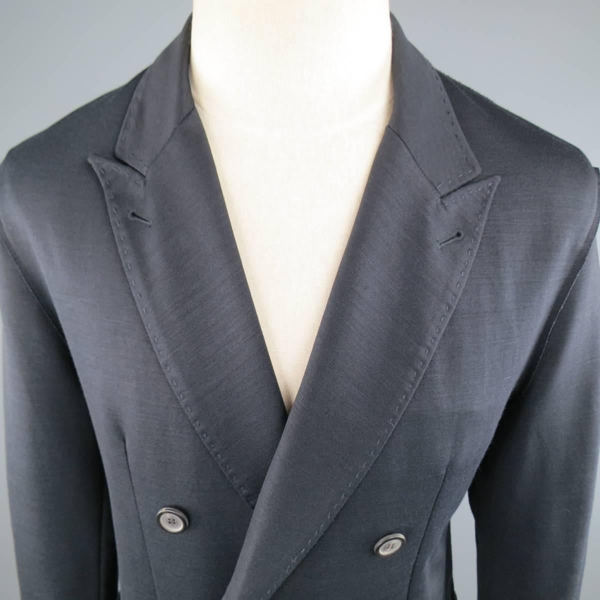 Casual LANVIN sport coat in a navy blue stretch ramie blend jersey featuring a peak lapel, double breasted closure, patch pockets, top stitching, and reverse raw edge seams throughout. Made in Romania.
 
Excellent Pre-Owned Condition.
Marked: T 50
