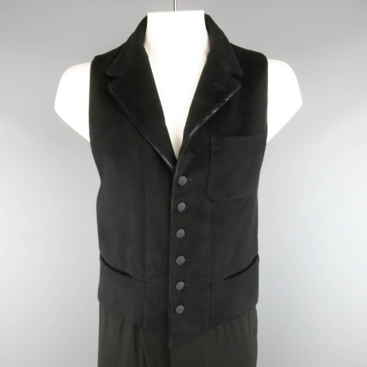 ANN DEMEULEMEESTER vest comes in a fuzzy flannel fabric and features a textured button up front with pointed notch lapel and extended flowy rayon viscose layer. Made in Tunisia.
 
Excellent Pre-Owned Condition.
Marked: L
 
Measurements:
 
Shoulder:
