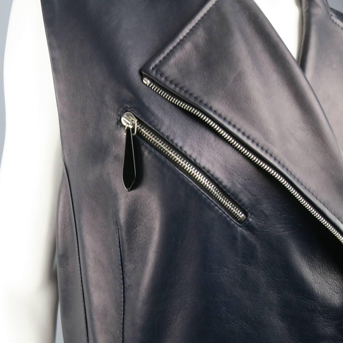 LENA LUMELSKY motorcycle style biker vest in a soft smooth navy blue leather and features a double breasted zip closure, pointed lapels, zip pockets with black bead  charm pulls, and a structured back. Minor wear on leather. Made in Belgium.
 
Good