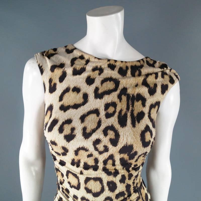 Fabulous sleeveless maxi dress by ROBERTO CAVALLI. This sexy number comes in a light weight stretch material in gorgeous leopard print and features gathered  ruching along the sides , a black tie died stripe along the waist, and a ruched circular