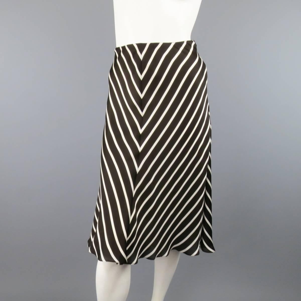 Vintage RALPH LAUREN COLLECTION A line skirt in a cream and brown striped silk. Fully lined. Made in USA.
 
Excellent Pre-Owned Condition. 
Retails at $1,500.00.
Marked: US 8
 
Measurements:
 
Waist: 30 in.
Hip: 50 in.
Length: 27 in.
