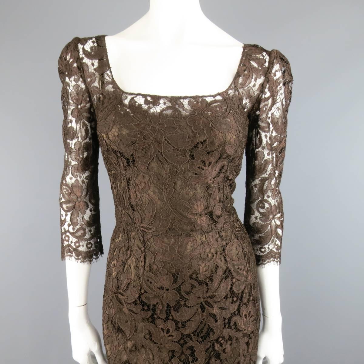 DOLCE & GABBANA cocktail dress in a chocolate brown lace featuring a scoop neck,  three quarter sleeves, fitted silhouette, v back, and built in stretch satin slip liner. Tags removed. Made in Italy.
 
Excellent Pre-Owned Condition. Retails at