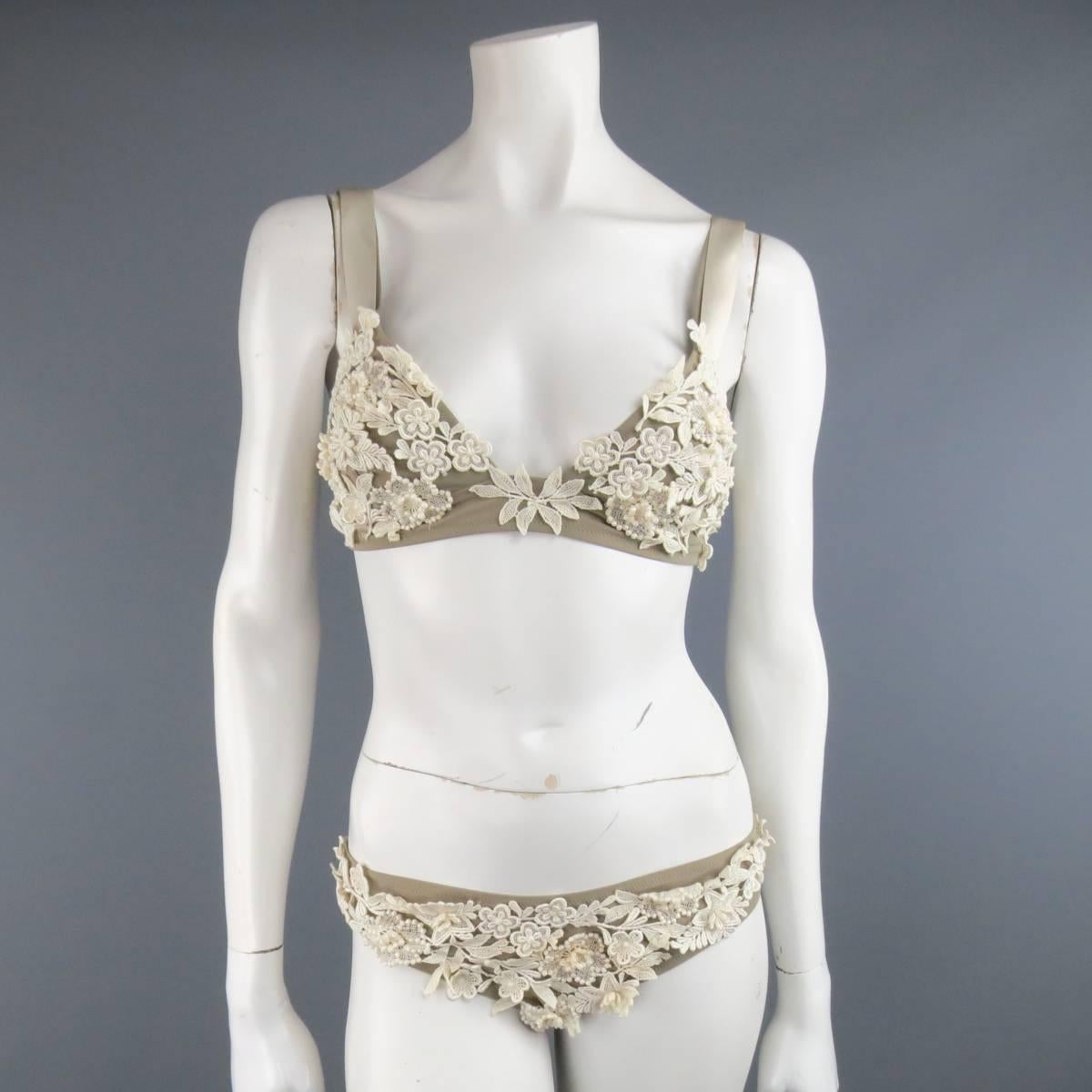 OSCAR DE LA RENTA Bridal Collection lingerie set in a thick taupe stretch fabric with cream lace appliques throughout and  includes a bra top with satin ribbon overlay straps and matching low rise briefs. Made in Italy.
 
Good Pre-Owned