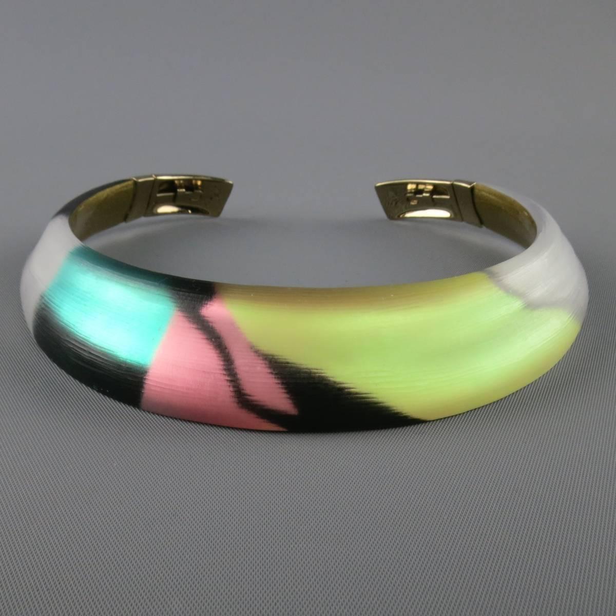 ALEXIS BITTAR neck cuff in a gorgeous frosted lucite with black, white, turquoise, pink, and yellow metallic mosaic print with a gold flake interior and hinged closure.
 
Excellent Pre-Owned Condition.
 
Length: 14 in.
Width: 1 in.