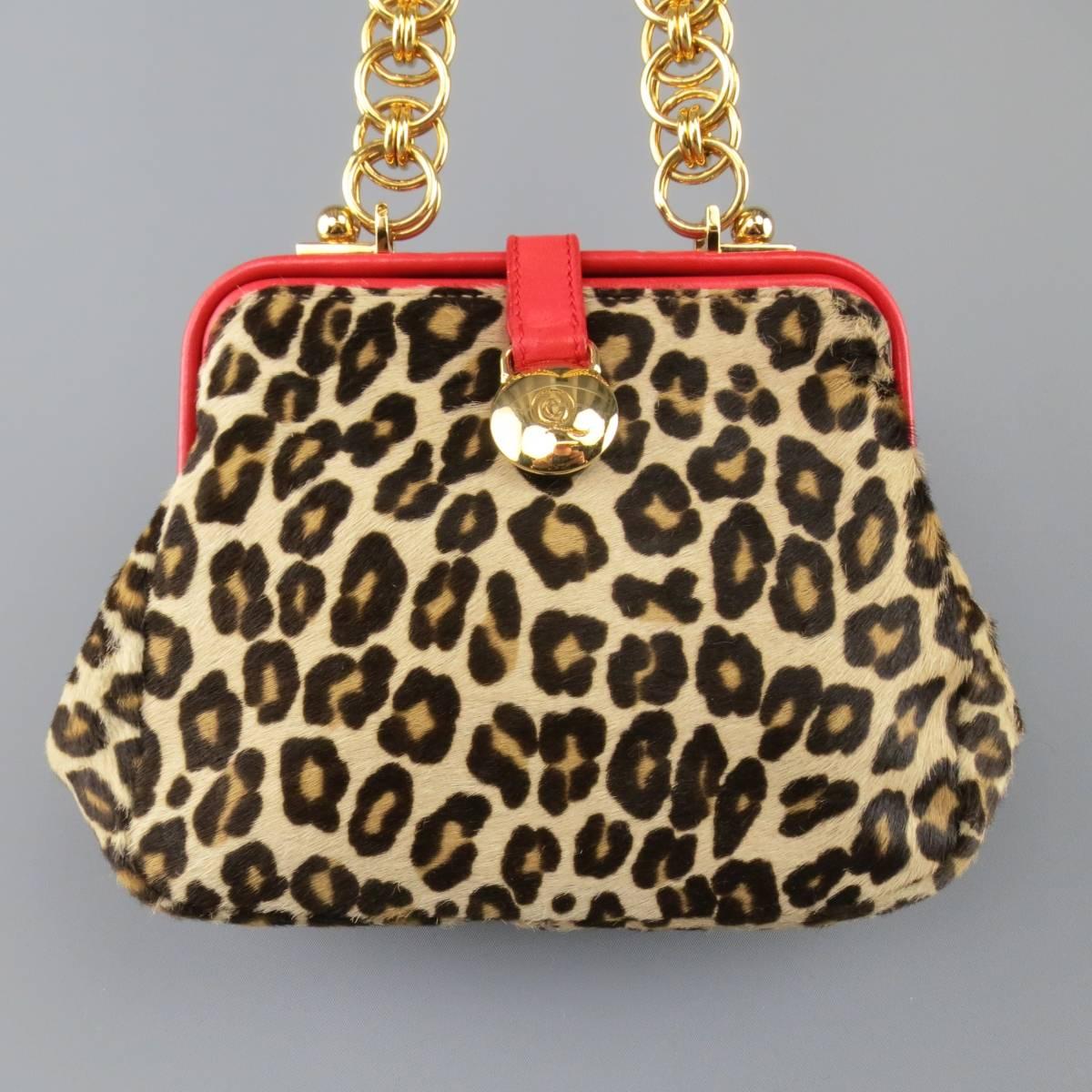 ALEXANDER MCQUEEN purse in a beige cheetah leopard print ponyhair leather features bright red leather details yellow gold tone hoop chain shoulder strap and snap closure. Minor Wear.
 
Good Pre-Owned Condition.
 
Measurements:
 
Length: 9 in.
Width: