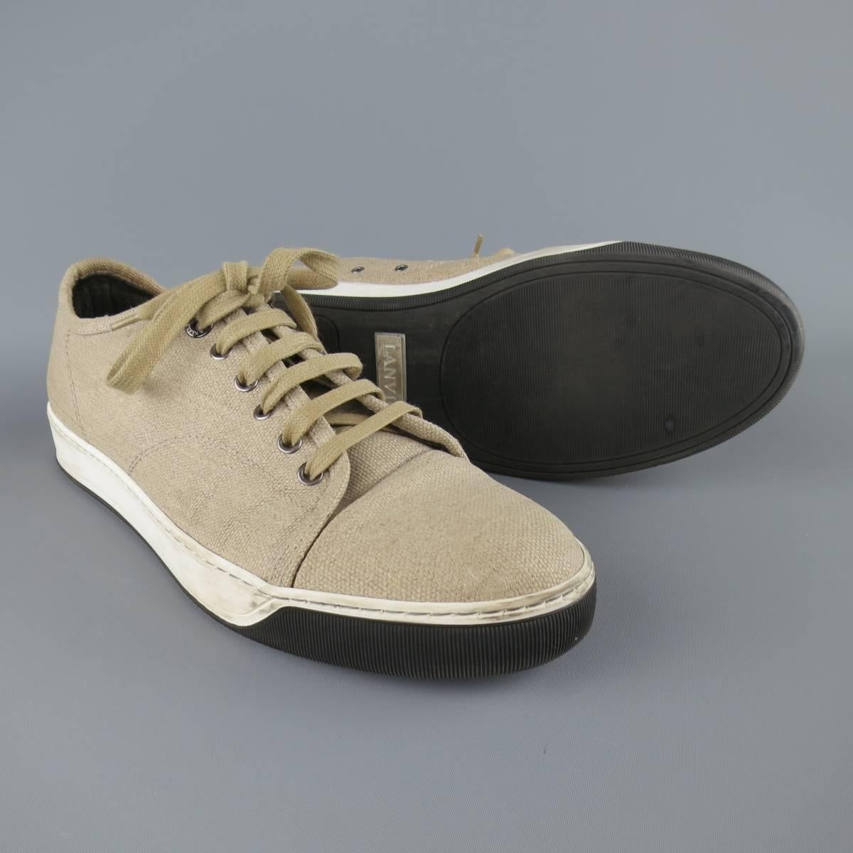 LANVIN sneakers in a oatmeal beige woven canvas with cap toe and black and white sole. Wear throughout. Made in Portugal.
 
Fair Pre-Owned Condition.
Marked: UK 7
 
Outsole: 11.25 x 4 in.