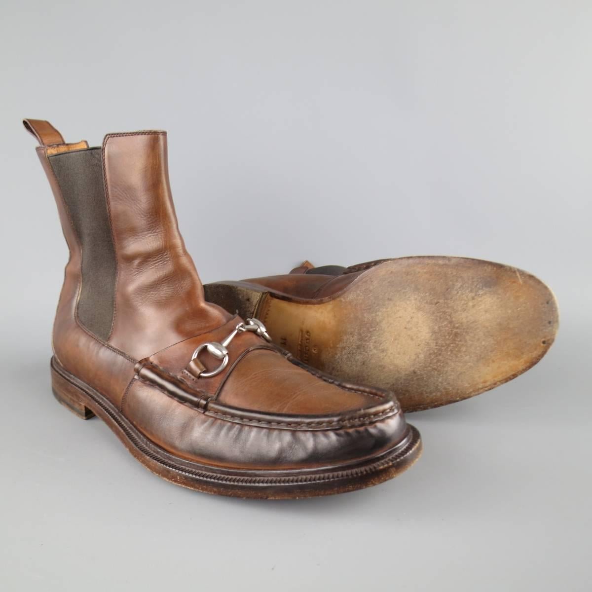 GUCCI ankle boots in a distressed tan brown leather featuring a loafer top stitch toe with silver tone horsebit. Made in Italy.
 
Good Pre-Owned Condition.
Marked: UK 11
 
Outsole: 12.5 X 4.5 in.
Height: 6.5 in.
