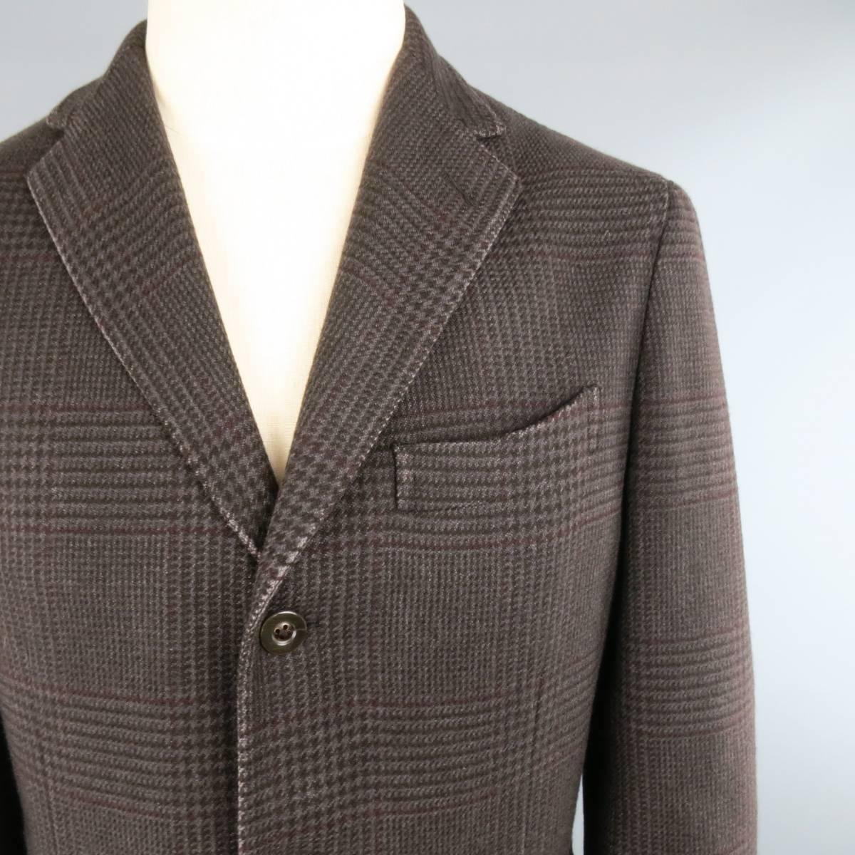 BOGLIOLI Sport Coat consists of cashmere material in a brown color tone. Designed in a notch lapel collar, 3-button front and plaid pattern. Detailed with a top pocket square and bottom patch pockets. 4-button cuffs, double back vent and