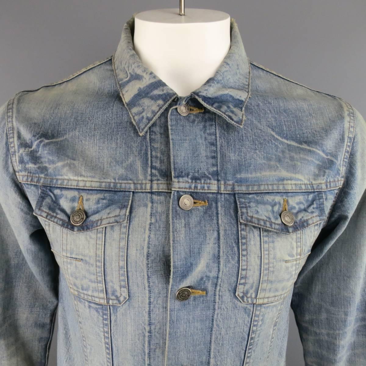 DIOR HOMME by Hedi Slimane shrunken trucker jacket in a light weight acid washed cotton denim with distressed details, silver tone hardware, and signature stitch darts. Made in Japan.
 
Excellent Pre-Owned Condition.
Marked: IT 52
 
Measurements:
