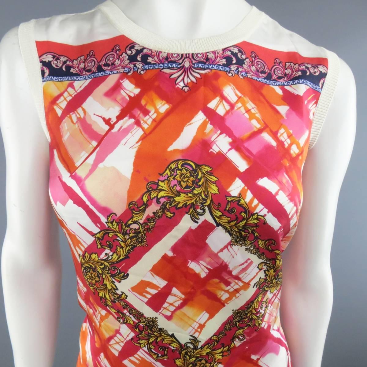 VERSACE COLLECTION silk blend sleeveless blouse features watercolor & brocade  print in warm hues of orange and fuchsia. Brand new with tags.
 
Excellent Pre-Owned Condition.
Marked: 44
 
Measurements:
 
Shoulders: 30 In.
Bust: 41 In.
Length: 23