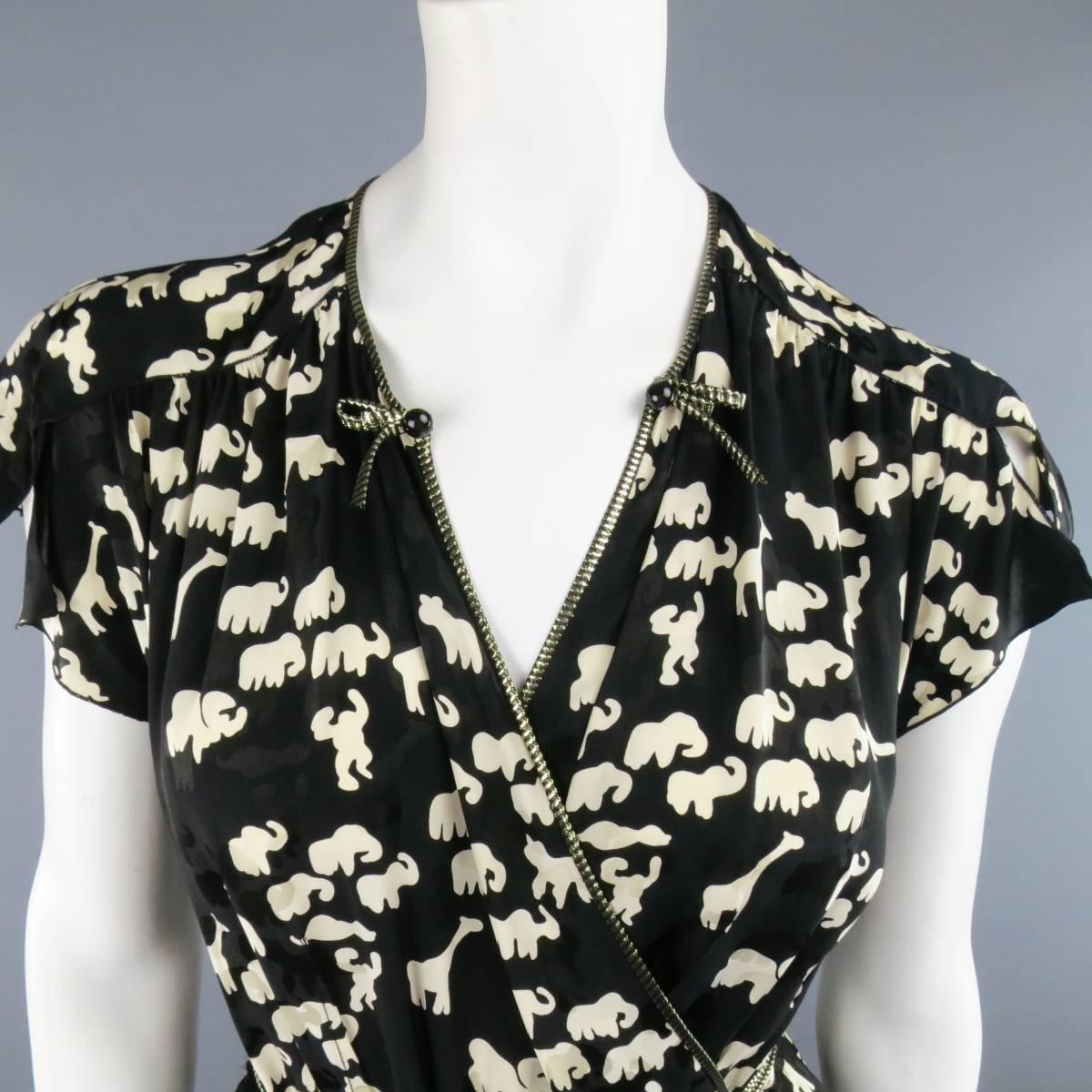 MARC JACOBS wrap blouse in a black and beige animal print featuring short slit sleeves, metallic gold piping, v neck with bow applique, and long wrap and tie closure. Made in USA.
 
Excellent Pre-Owned Condition.
Marked: 4 USA
 
Measurements:
