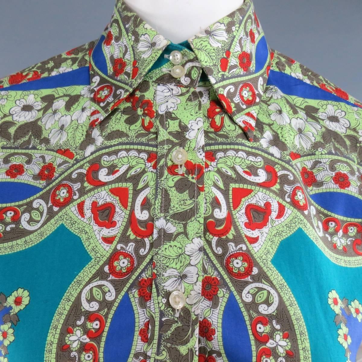 ETRO blouse in a teal and blue cotton with all over green and red floral bandanna print. Made in Italy.
 
Good Pre-Owned Condition.
Marked: IT 50
 
Measurements:
 
Shoulder: 16 in.
Bust: 46 in.
Sleeve: 25 in.
Length: 27 in.