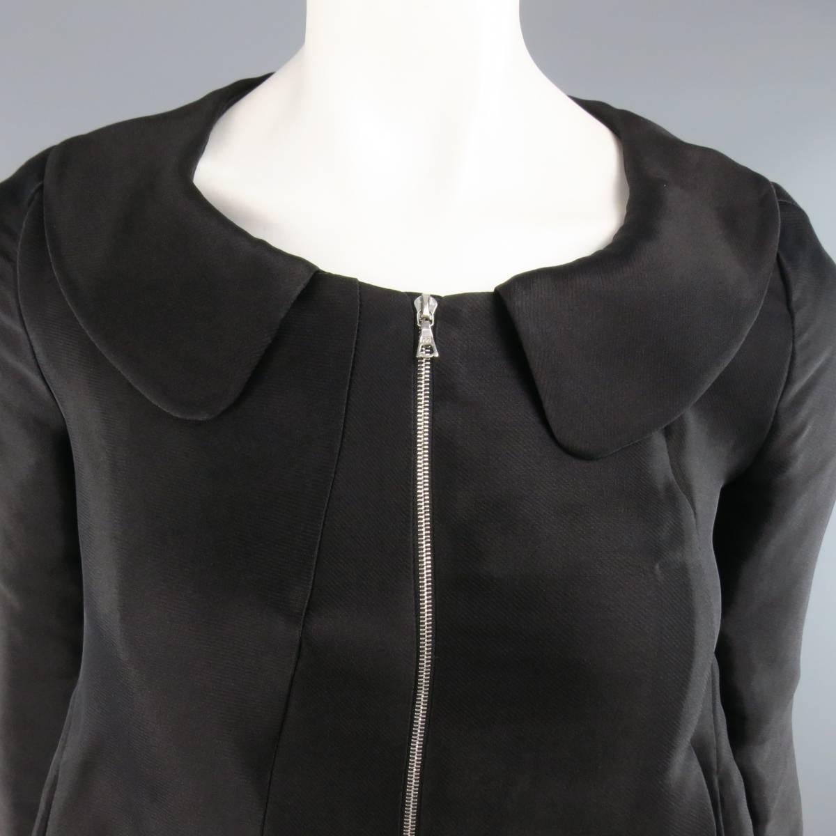 MARNI black silk linen blend jacket features a wide club collar, cropped three-quarter length sleeves, asymmetrical pleating, double zipper closure, ruffled, cropped hem in the back. Made in Italy.
 
Excellent Pre-Owned Condition.
Marked: 38 IT.
