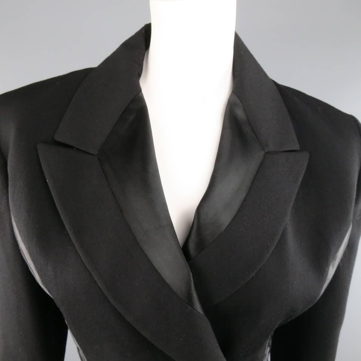 JOHN GALLIANO black wool jacket features a peak lapel with black silk detailing, side quilted silk paneling detailing, single button closure, and cropped hem. Made in the UK.
 
Good Pre-Owned Condition.
Marked: 34
 
Measurements:
 
Shoulders: 17