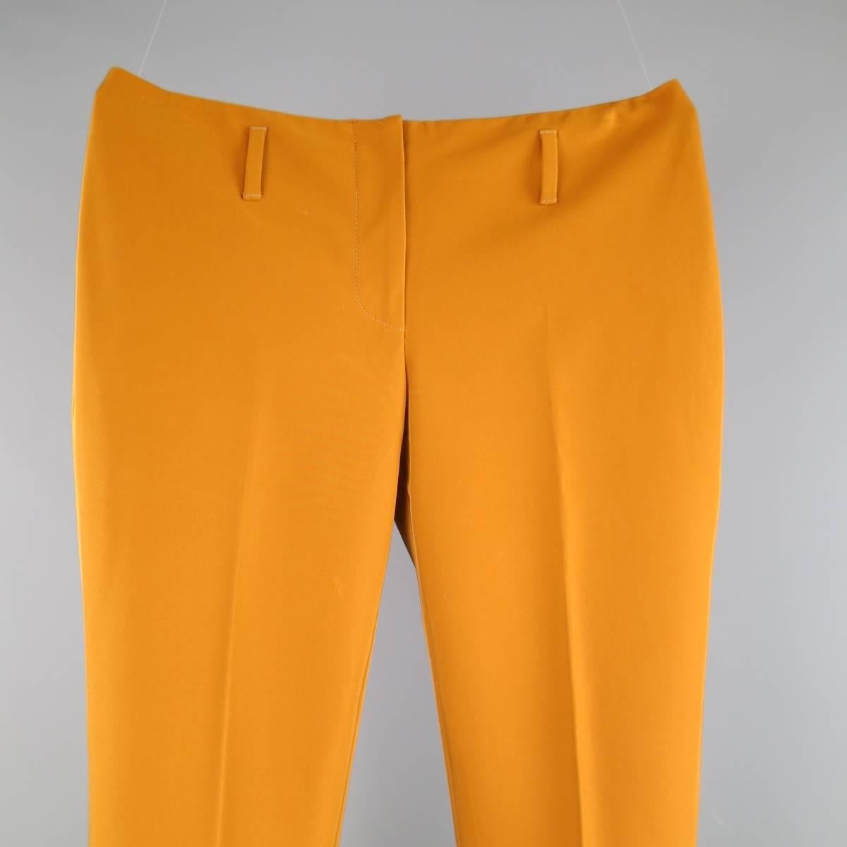 PRADA polyester blend pants in a structured tan stretch polyester twill and feature a low rise with seamless waistband, belt loops, and slightly flared leg. Made in Italy.
 
Excellent Pre-Owed Condition.
Marked: 42 IT
 
Measurements:
 
Waist: 30