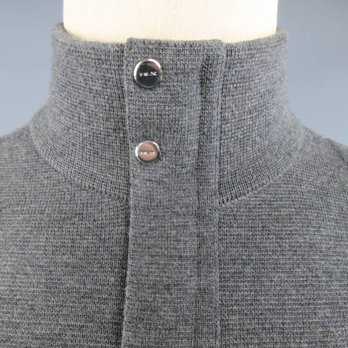 RLX RALPH LAUREN jacket in a gray merino wool knit featuring a high collar, hidden placket zip closure, zip pockets with tan leather piping, and tan leather elbow panels. Wear on leather. As-Is.
 
Fair Pre-Owned Condition.
Marked: S
 
Measurements:
