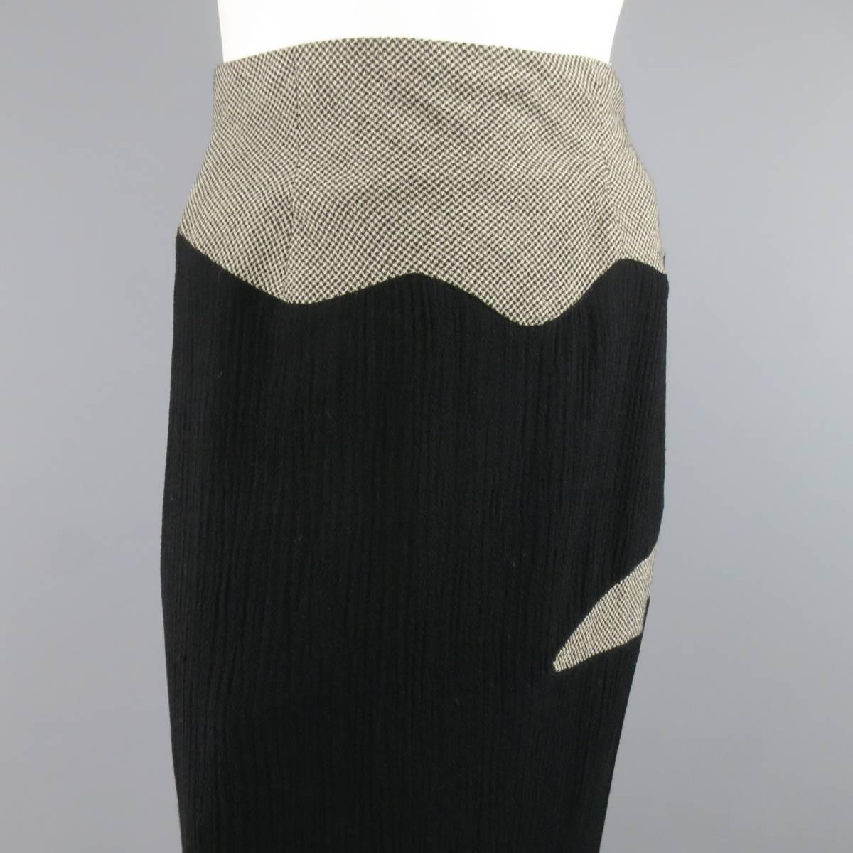 MATSUDA wool blend maxi flare skirt features hounds tooth pattern shapes atop solid black. Side zipper closure and adjustable belt in the back. Made in Japan.
 
Good Pre-Owned Condition.
Marked: 40
 
Measurements:
 
Waist: 27 In.
Hips: 39