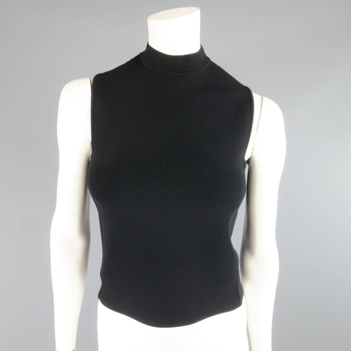 RALPH LAUREN Collection top comes in a ribbed stretch bandage fabric with a boxy cut and mock neck. Made in Italy.
 
Excellent Pre-Owned Condition.
Marked: S
 
Measurements:
 
Shoulders: 12 In.
Bust: 34 In.
Length: 19 In.