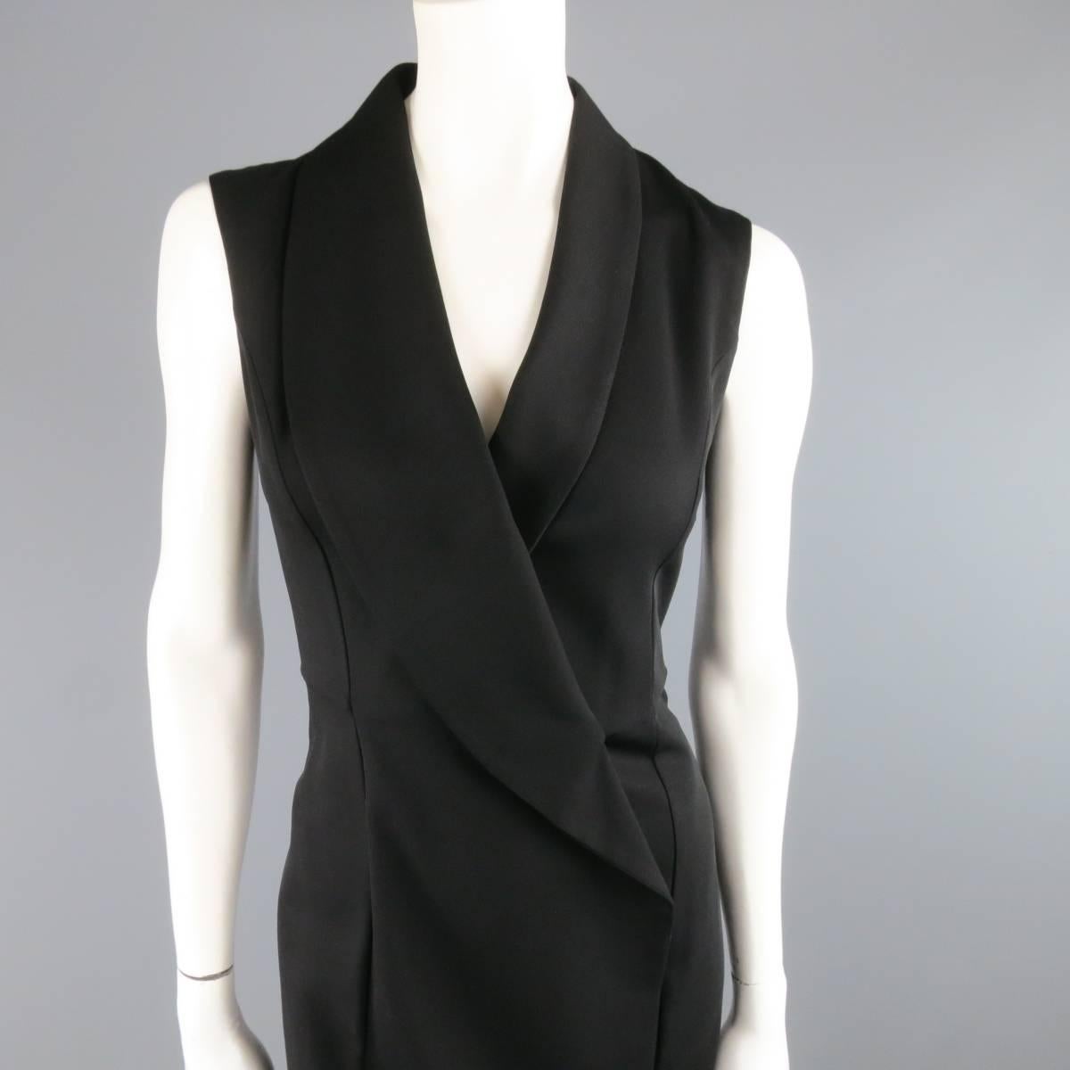 MAISON MARTIN MARGIELA wool blend black dress features an oversize shawl collar lapel in a faux wrap stye. Fully lined with a side zipper closure. Brand new with tags.
 
New with Tags. Retails at $1195.00.
Marked: 40
 
Measurements:
 
Shoulders: