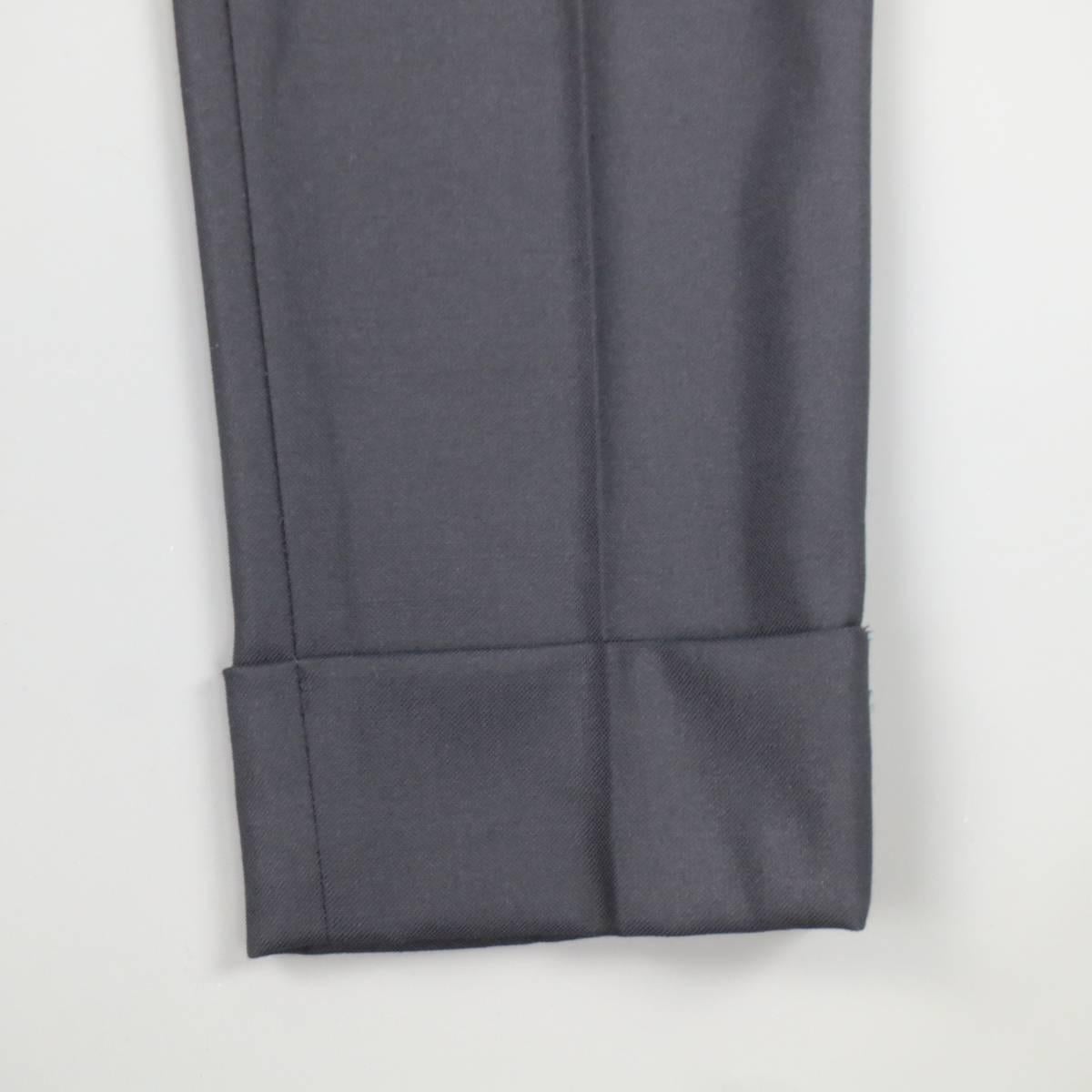 THE ROW navy blue virgin wool dress pants feature a tweed texture size zipper closure with hook and eye. side slit pockets, front pleats, and cuffed hems. Made in USA.
 
Excellent Pre-Owned Condition.
Marked: 0
 
Measurements:
 
Waist: 29 In.
Rise: