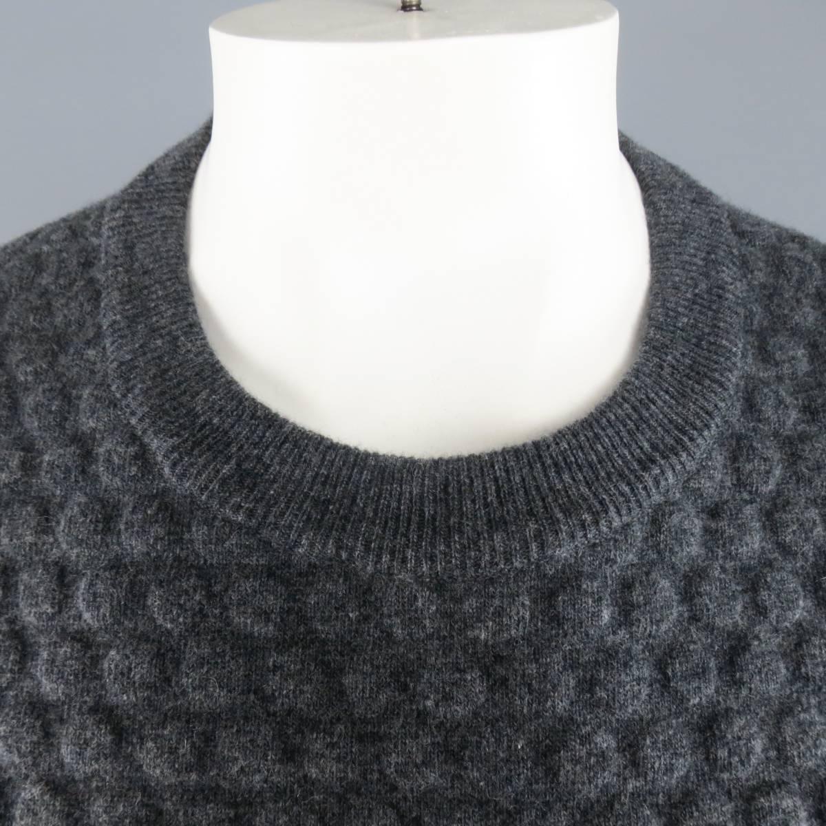 JIL SANDER crewneck pullover in a dark heather gray wool cashmere blend featuring a 3D embossed polka dot pattern neoprene bonded front. Made in Italy.
 
New with Tags.
Marked: IT 52
 
Measurements:
 
Shoulder: 20 in.
Chest: 48 in.
Sleeve: 28