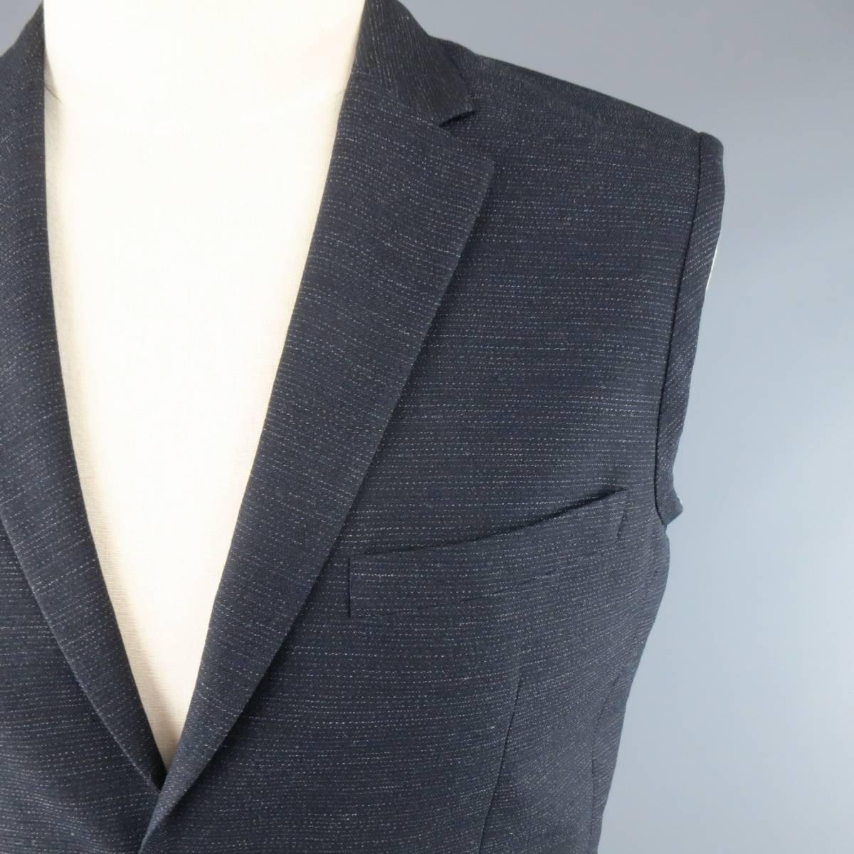 This MARNI sleeveless sport coat vest comes in a navy and gray textured wool blend fabric and features a notch lapel, two button closure, and single vented back. Made in Italy.
 
Excellent Pre-Owned Condition.
Marked: IT 48
 
Measurements:
