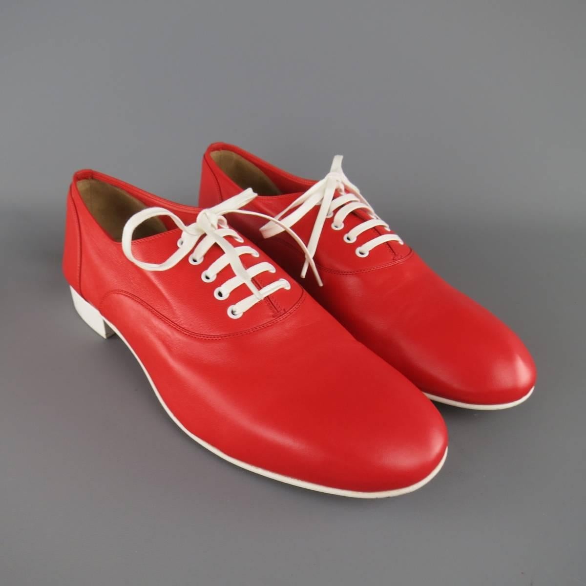 CHRISTIAN LOUBOUTIN "Alfred Flat" lace ups in a vibrant red soft leather featuring a white midsole, grommets, and heel with signature red sole. With Box. Made in Italy.
 
Excellent Pre-Owned Condition.
Marked: IT 42
 
Outsole: 11 x 4 in.