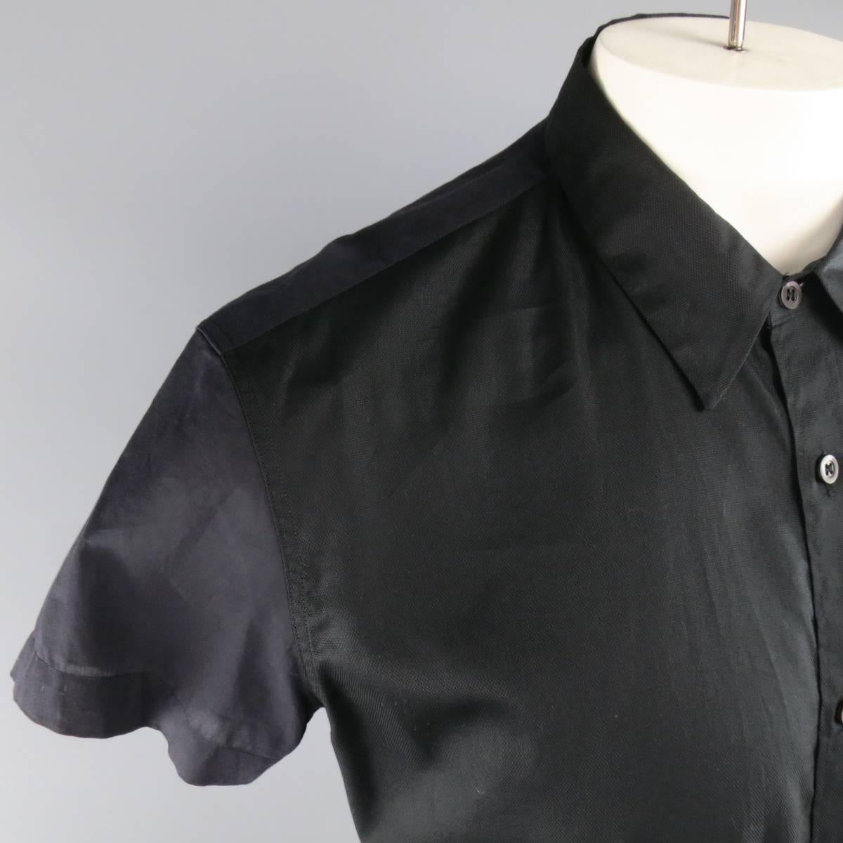 DRIES VAN NOTEN short sleeve shirt features a textured front with pointed collar and semi sheer back.
 
Excellent Pre-Owned Condition.
Marked: IT 52
 
Measurements:
 
Shoulder: 18 in.
Chest: 46 in.
Sleeve: 6 in.
Length: 28 in.