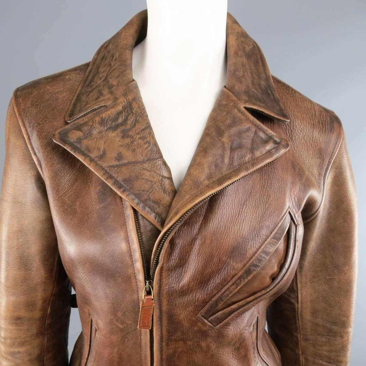RALPH LAUREN COLLECTION biker jacket in a structured, distressed tan brown leather featuring a pointed lapel, zip closure, slanted pockets, and side tabs. Wear throughout.
 
Good Pre-Owned Condition.
No Size.
 
Measurements:
 
Shoulder: 16 in.
Bust: