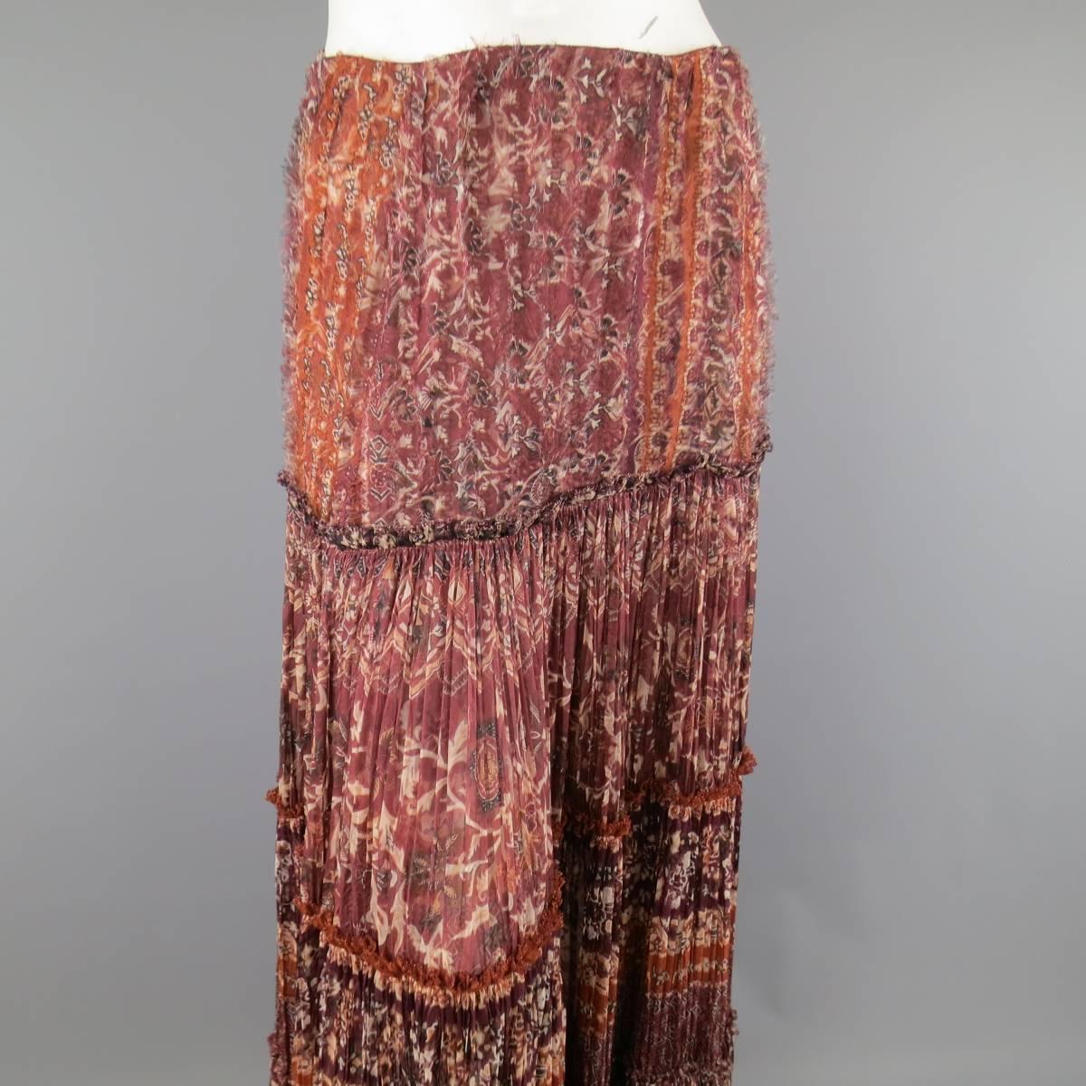 OSCAR DE LA RENTA Spring Summer 2006 maxi skirt in a burgundy and orange textured floral print silk featuring panels of wrinkle pleats, frayed texture, and ruffle trim. Made in USA.
 
Excellent Pre-Owned Condition.
Marked: 8
 
Measurements:
 
Waist: