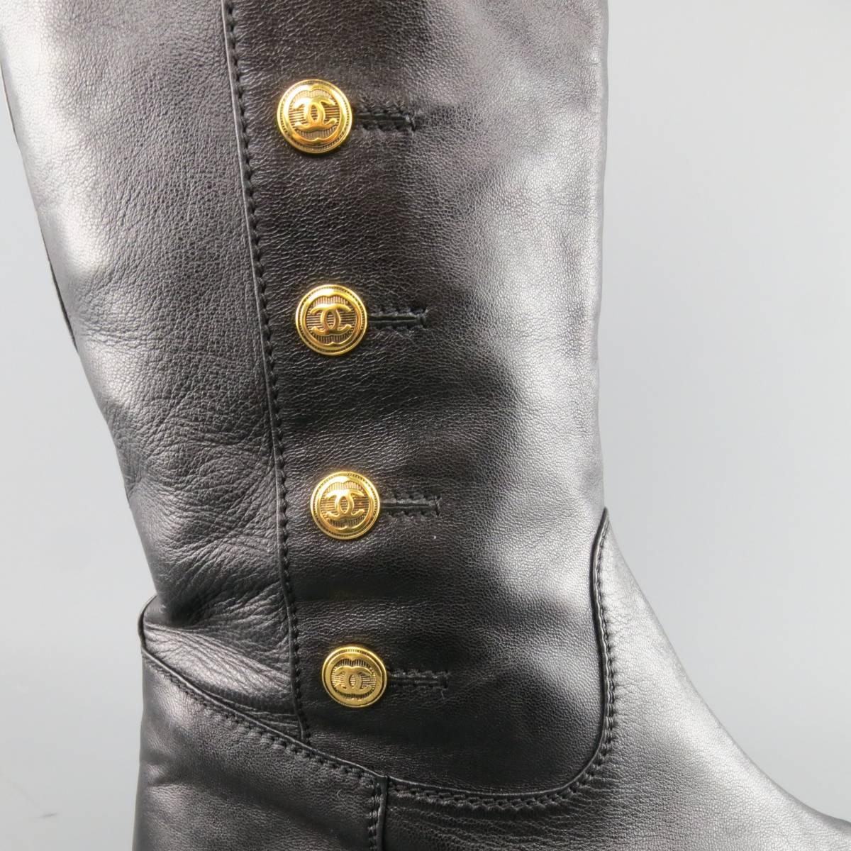 Vintage CHANEL knee high pull on boots in a smooth black leather featuring a rounded point toe and simulated gold tone CC button up sides. Minor wear and imperfection on toe. As-Is. Made in Italy.
 
Fair Pre-Owned Condition.
Marked: IT 41
 
Outsole: