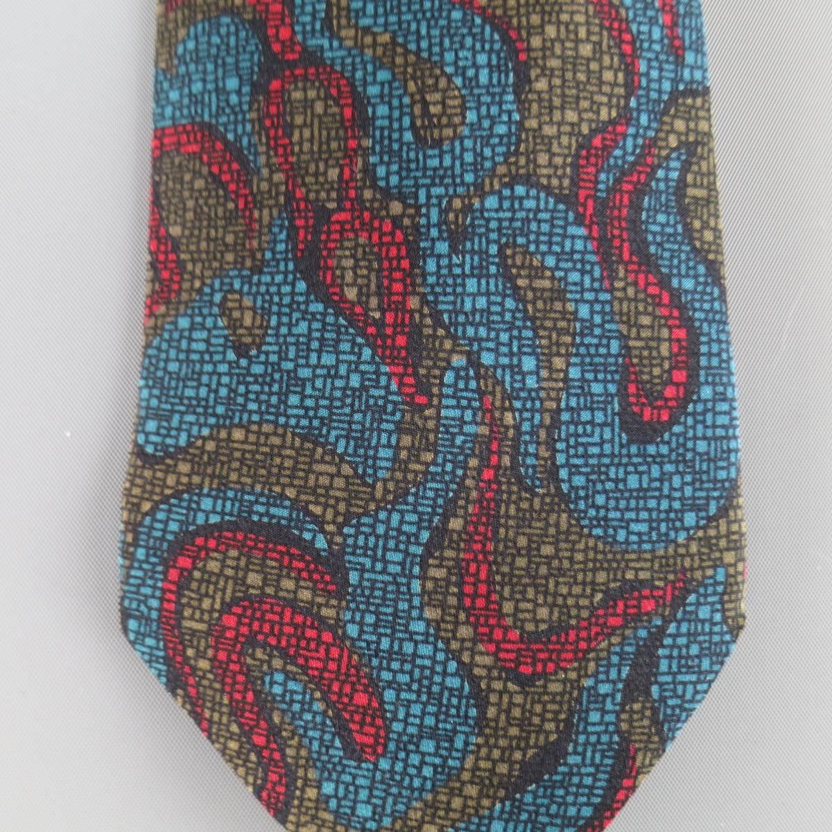 GIANNI VERSACE Vintage Tie consists of 100% silk material in a teal color tone. Designed in a modern abstract style, wave pattern with graphic print in red, taupe and teal accents. Comes with original boxing. Made in Italy.
 
Excellent Pre-Owned