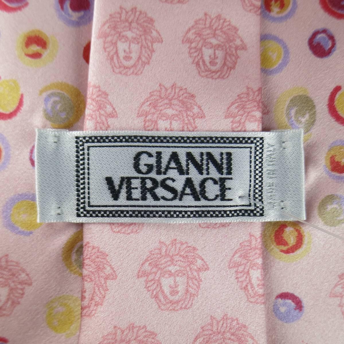 Women's or Men's GIANNI VERSACE Vintage Tie consists of 100% silk material in a pink color tone. 
