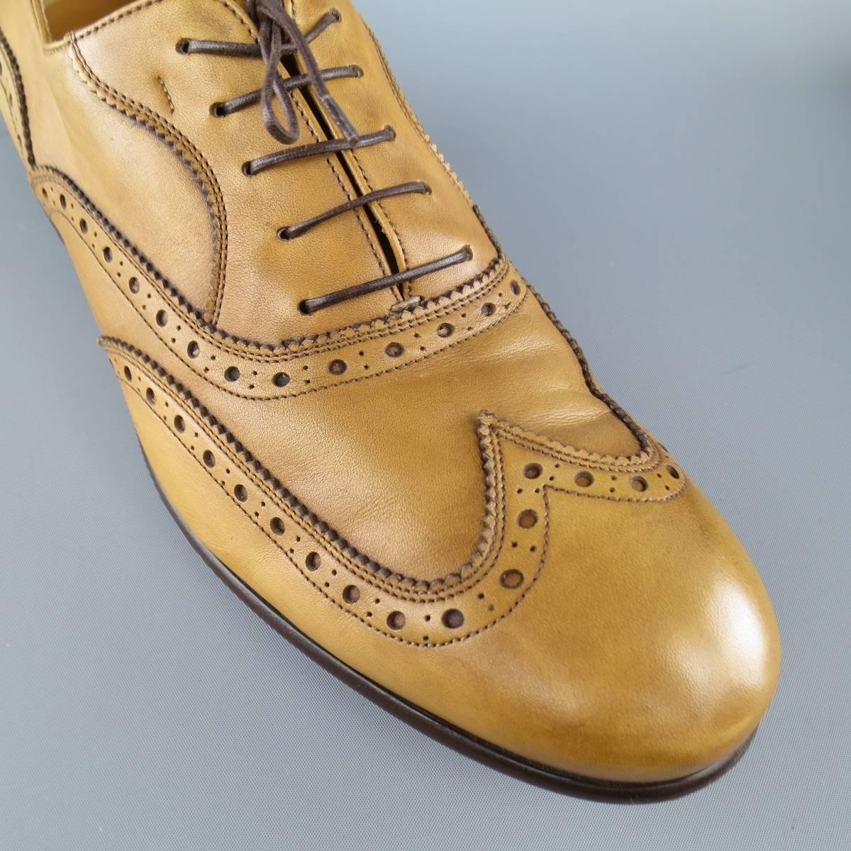 SALVATORE FERRAGAMO dress shoes in a light tan leather featuring perforated brogue detailing throughout and a wingtip toe. Made in Italy.
 
Good Pre-Owned Condition.
Marked:11
 
Outsole: 12.5 x 4 in.
