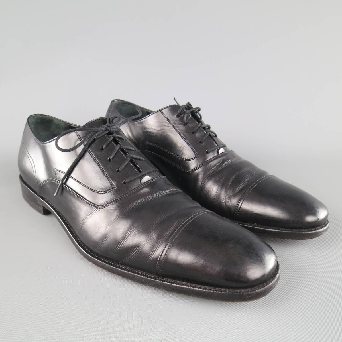 SALVATORE FERRAGAMO Lace Up Shoes consists of leather material in a black color tone. Detailed in a round, cap-toe front with tone-on-tone stitching along vamp. Leather sole with rubber heel. Made in Italy.
 
Fair Pre-Owned Condition
Marked Size: 11