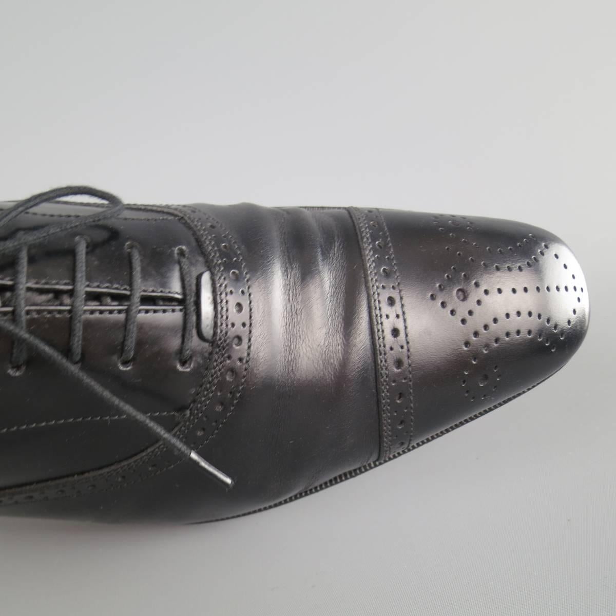 SALVATORE FERRAGAMO Lace Up Shoes consists of leather material in a black color tone. Designed with a pointed round toe front, wingtip detail and perforated pattern. Leather sole with rubber heel. Made in Italy.
 
Good Pre-Owned Condition 
Marked