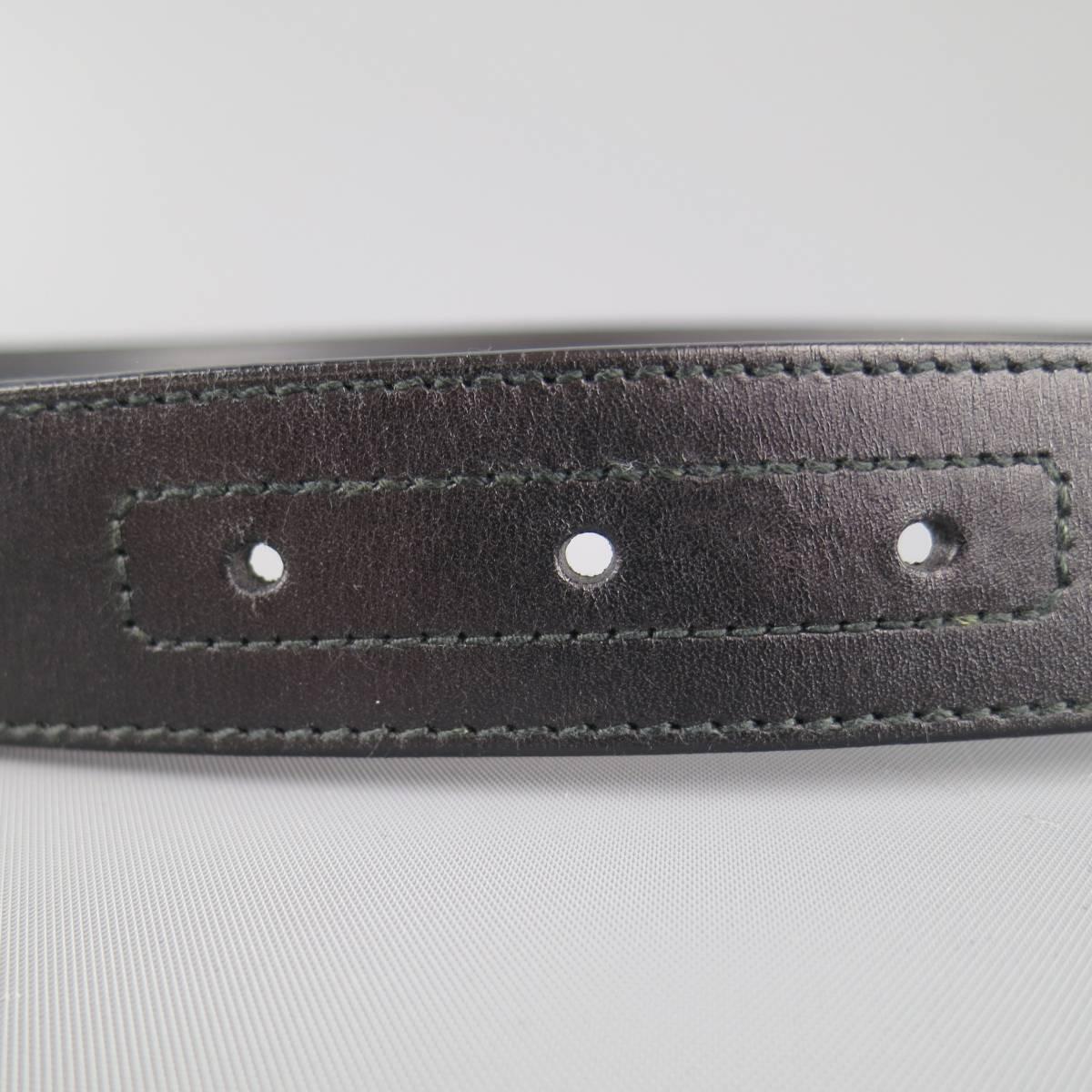 GUCCI belt features a smooth black leather strap and silver tone mini double G buckle. Made in Italy.
 
Good Pre-Owned Condition.
Marked: 90.36
 
Length: 42 in.
Width: 1.25 in.
Fits: 35-37 in.
Buckle: 2 x 1.75 in.