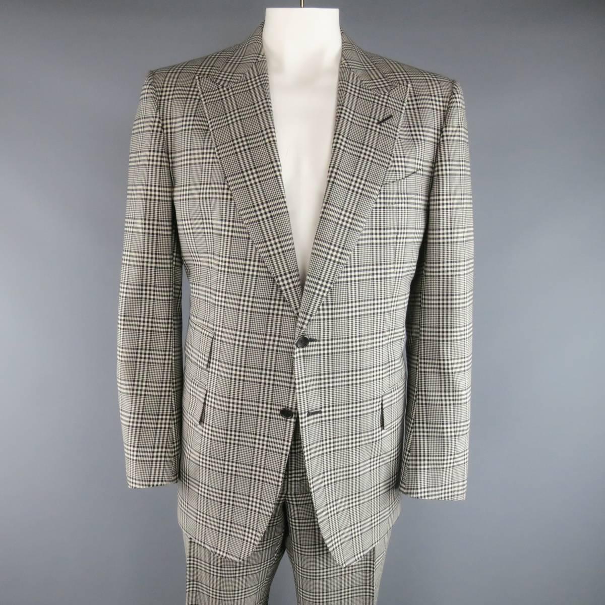 Two Piece Tom Ford suit comes in an off white and black large scale glenplaid print wool mohair blend fabric and includes a two button, peak lapel sport coat with triple flap pockets, and functional button cuffs with matching flat front, adjustable