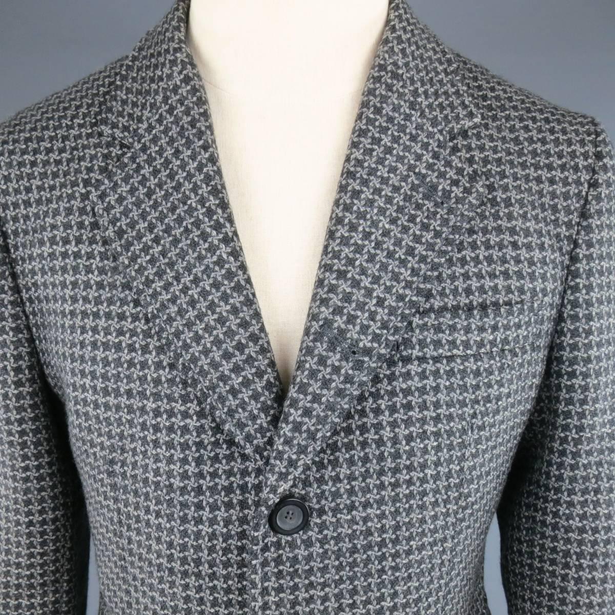 EMPORIO ARMANI three button sport coat in a gray and charcoal houndstooth virgin wool featuring a notch lapel and patch flap pockets. Made in Italy.
 
Excellent Pre-Owned Condition.
Marked:IT 50
 
Measurements:
 
Shoulder: 16 in
Chest: 42