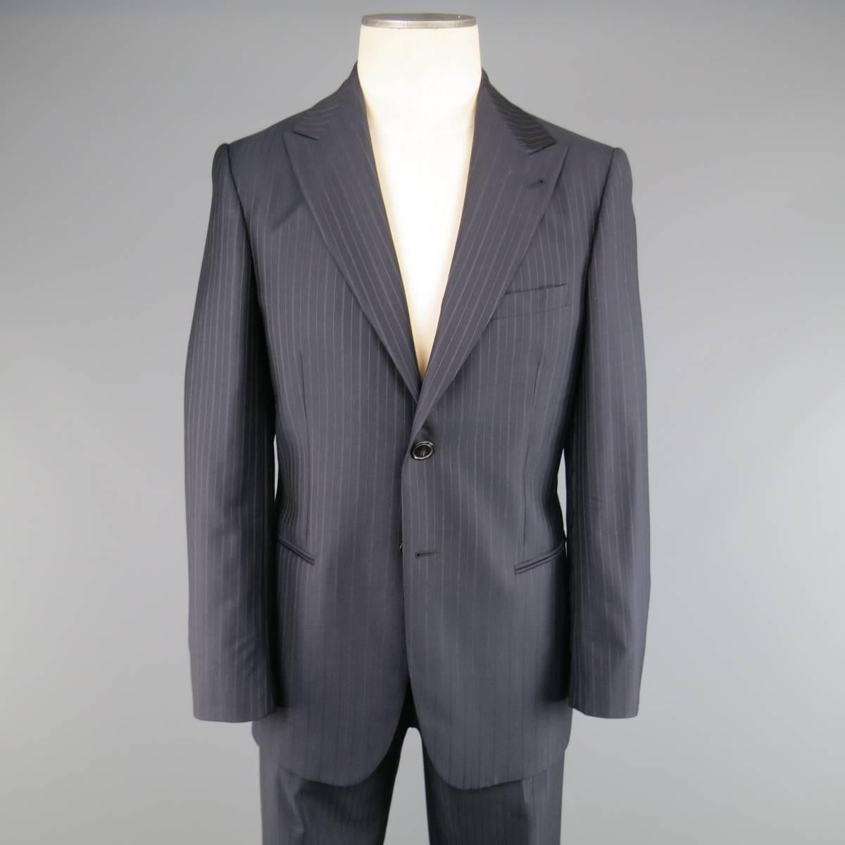 GIORGIO ARMANI suit in a navy blue wool with brown multi pinstraipe pattern includea a two button, notch lapel sport coat and flat front dress pants. Made in Italy.
 
Excellent Pre-Owned Condition.
Marked: IT 48
 
Measurements:
 
-Jacket
Shoulder: