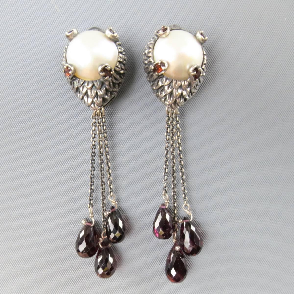 Vintage statement earrings feature a sterling silver leaf engraved base with oversized faux pearl center embellished with crystals and three cascading amethyst teardrops on chains.
 
Good Pre-Owned Condition.
Marked: 925
 
Length: 7.5 cm.
Width: 1.5