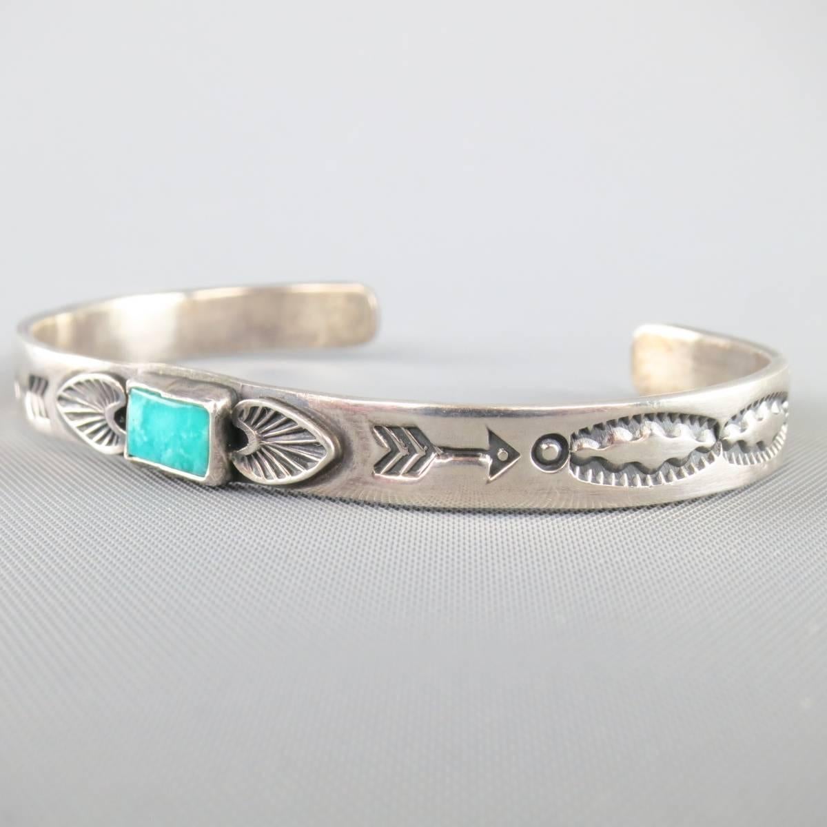 ALBERT JAKE cuff bracelet in sterling silver with Western engravings and Turquoise stone center.
 
Excellent Pre-Owned Condition.
 
Fits: 16.5 cm.
Width: 0.5 cm.


Web ID: 81992 