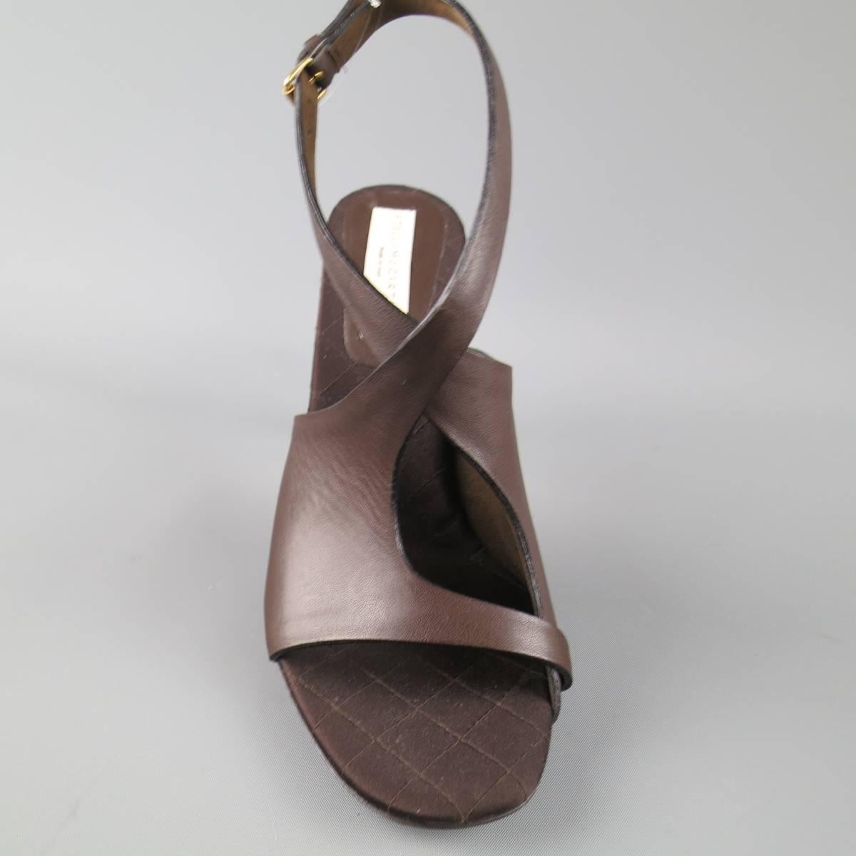 STELLA McCARTNEY sandals com in a deep chocolate brown vegan leather and feature a peep toe, thick cutout toe strap with crossed ankle straps, matte stiletto heel, and gold sole. Made in Italy.
 
Excellent Pre-Owned Condition.
Marked:IT 40.5
 
Heel: