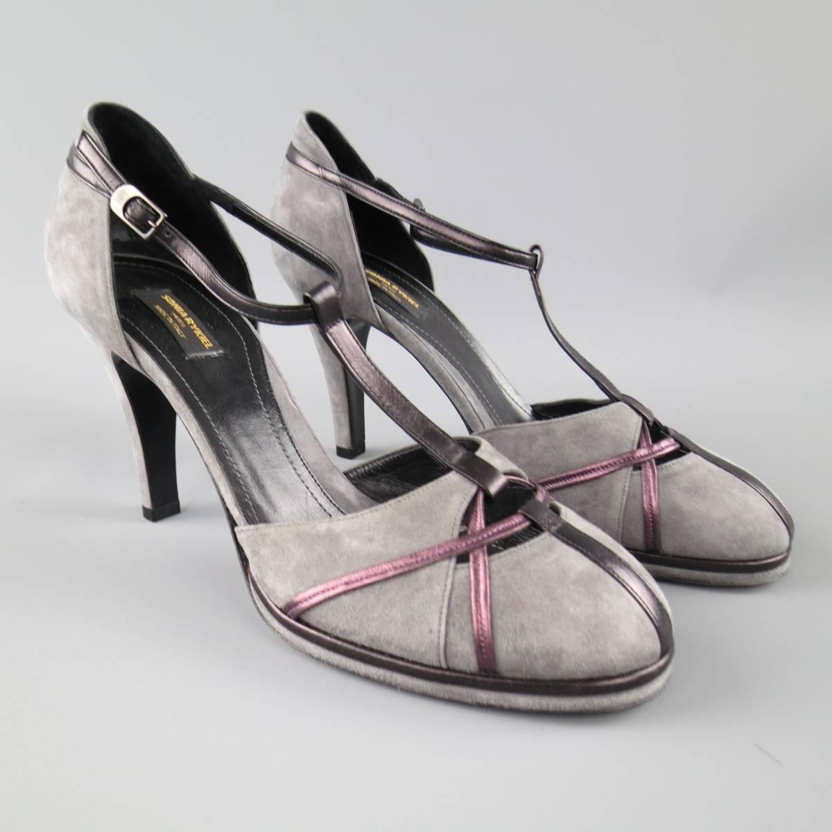 SONIA RYKIEL retro pumps come in gray suede and feature a round toe with metallic purple piping cutout details, covered heel, and black T strap. Made in Italy.
 
Good Pre-Owned Condition
Marked: IT 40
 
Heel: 4 in.


Web ID: 77632 